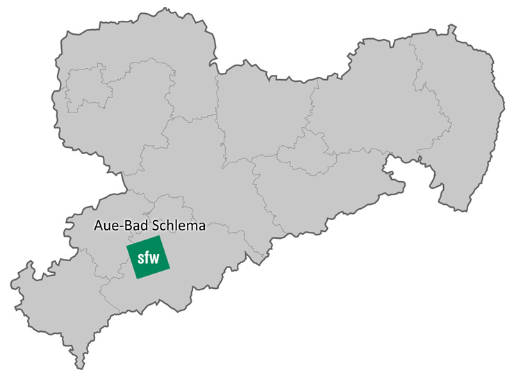 Es ist ein Kartenumriss von Sachsen zu sehen. Die Stadt Aue-Bad Schlema ist mit dem SFW-Firmenlogo markiert. 